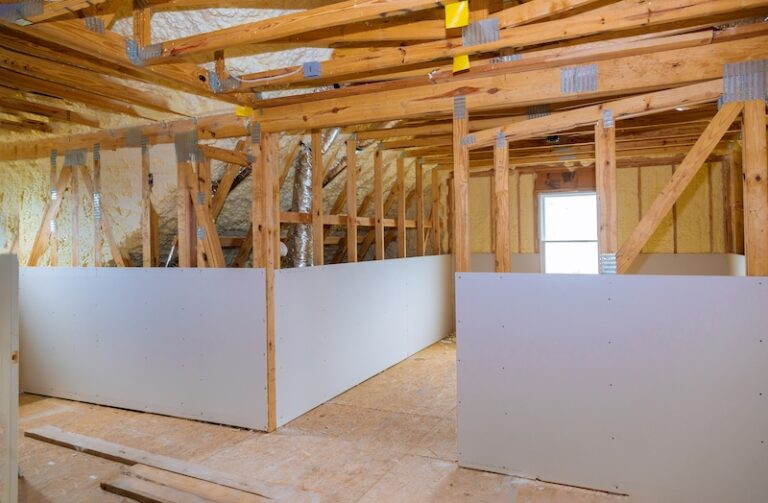 Insulation attic thermal inside wall and roof insulation in wooden house, building under construction